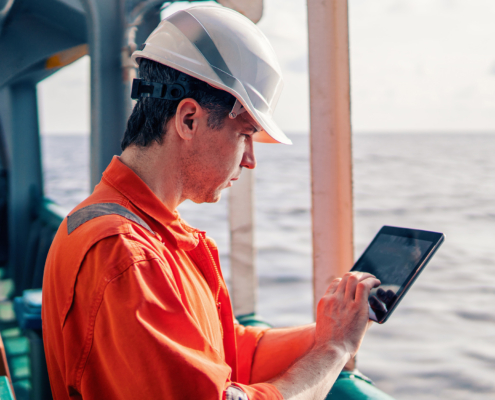 Engineer Using Tablet On Ship
