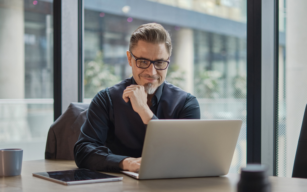 Man In Office Running Simulations On Computer
