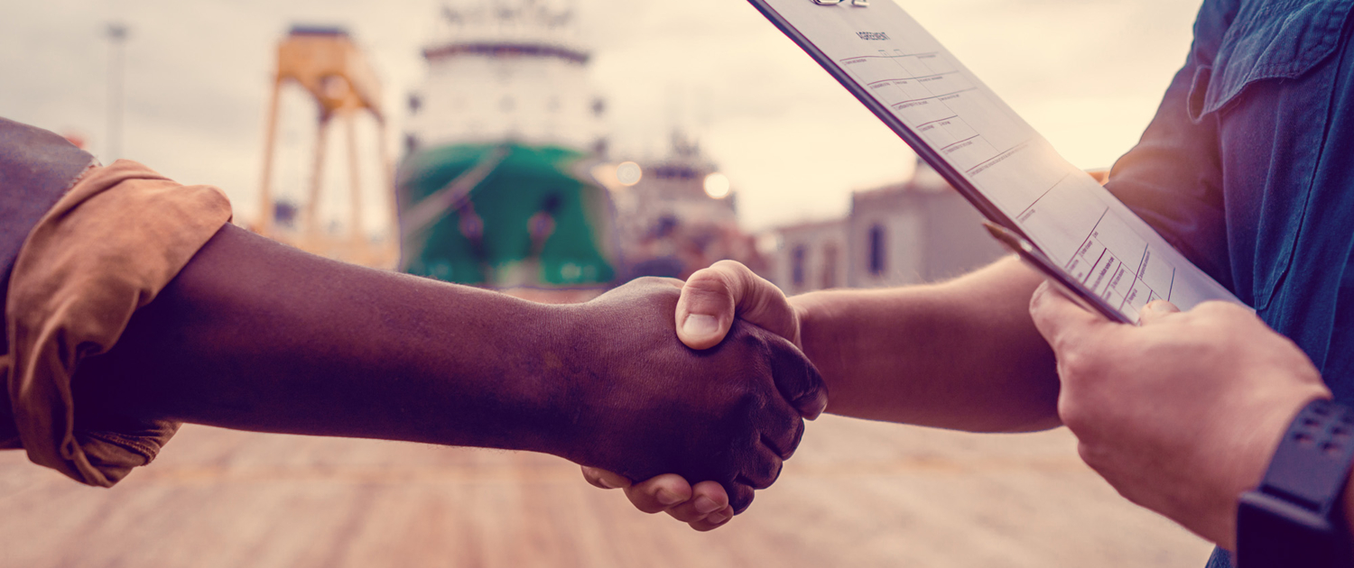 Marine Contractor Shaking Hands With Business Partner