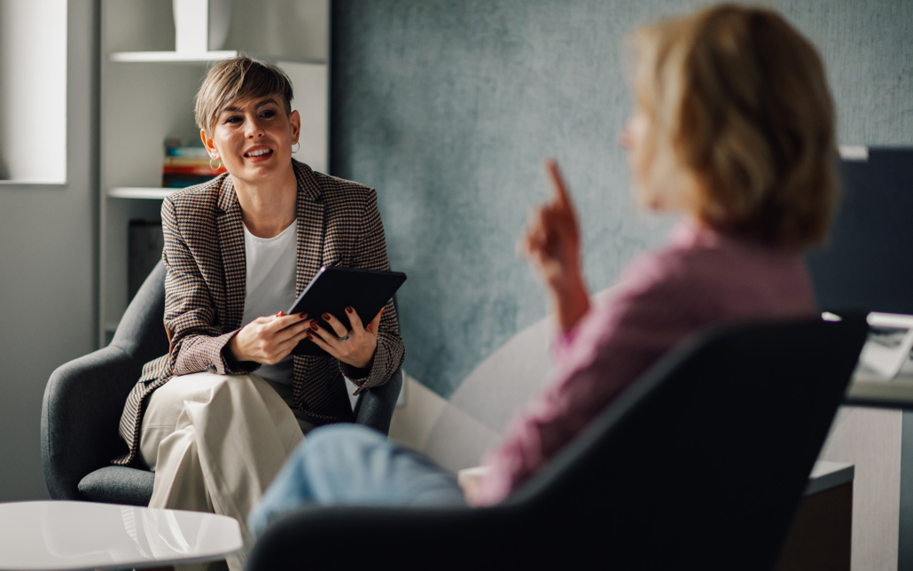 Woman Having Discussion With Client On Boat Design