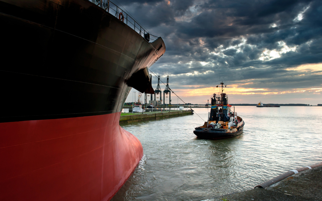 Large Ship And Work Boat Going Onto Water