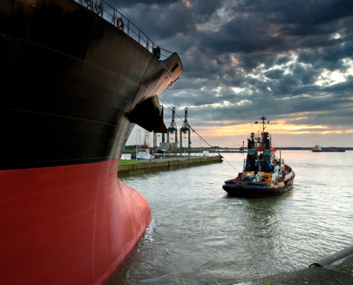 Large Ship And Work Boat Going Onto Water