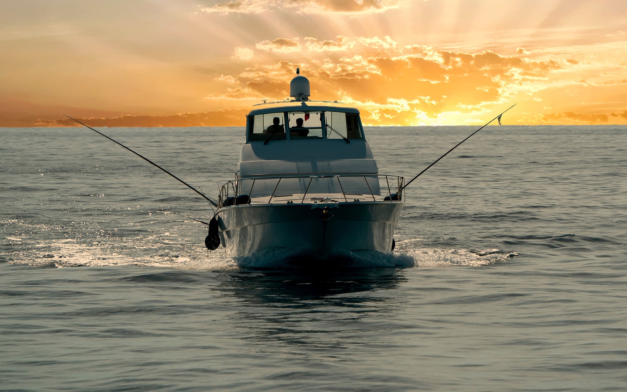 Small Touristic Fishing Boat Returning In Harbor At Sunset